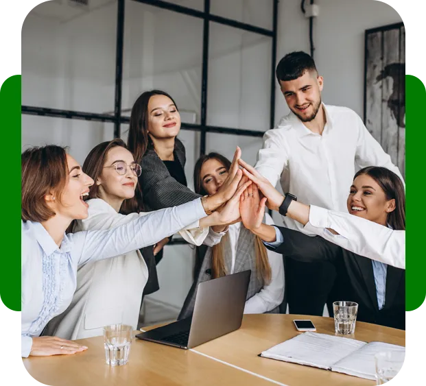 A business team celebrating together around a table